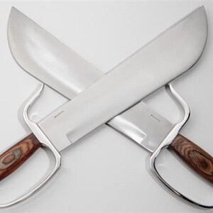 May include: A pair of silver-coloured, double-edged swords with wooden handles. The swords are crossed in an 'X' shape.