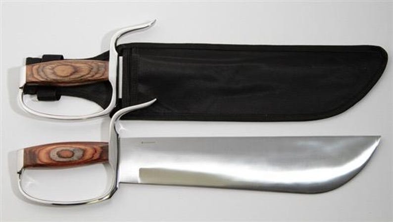 May include: A set of two silver-coloured martial arts swords with wooden handles. The swords are in a black sheath with a zipper.