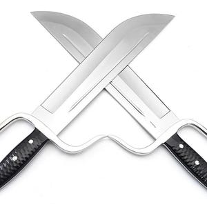 May include: A pair of silver-coloured, double-edged swords with black handles. The swords are crossed in an 'X' shape.