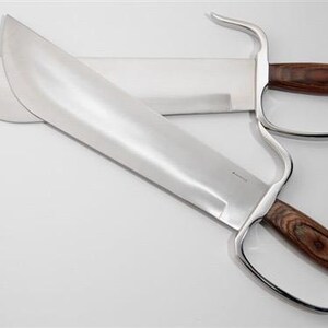May include: A pair of silver-coloured double-edged swords with wooden handles. The swords have a curved guard and a sharp point.