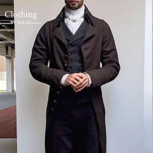 May include: A dark brown, long coat with a matching vest and trousers. The coat has a classic, button-down design. The image also shows a white collared shirt. The text "Clothing by MAAZ" is visible in the upper left corner.