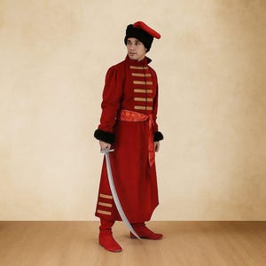 May include: A red historical costume with gold detailing, a black hat with a red peak, and a silver sword. The costume features a long coat, a decorative belt, and matching boots. The text "Clothing - BY MAAZ" is at the top.