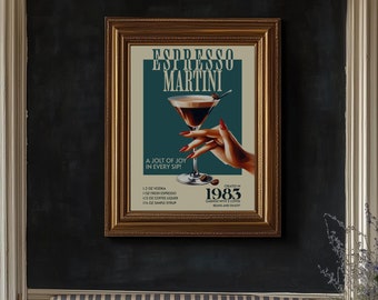 May include: A vintage-style poster with a teal background advertising an Espresso Martini cocktail. The poster features a martini glass with a brown and white cocktail, a hand holding the glass, and the text "Espresso Martini" in a bold, white font. The poster also includes the text "A jolt of joy in every sip!" and a list of ingredients. The poster is framed in a gold frame.