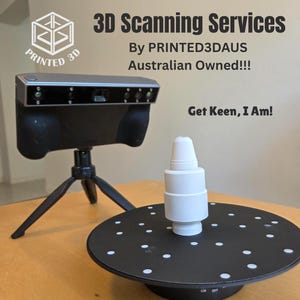 May include: A 3D scanning setup featuring a black and silver scanner on a tripod, a white object on a rotating black platform, and the text "3D Scanning Services" and "Get Keen, I Am!"