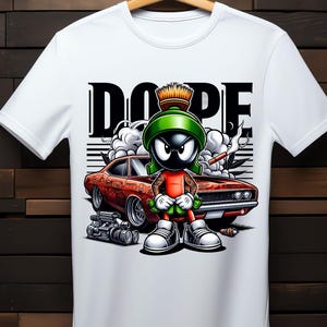 May include: White t-shirt featuring a cartoon character wearing a green hat and holding a cigar. The character is standing in front of a red car with the word "DOPE" printed above it.