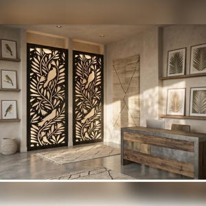 May include: Interior design featuring two large, black, laser-cut panels with a bird and foliage design. The room includes a wooden desk, framed botanical prints, and a neutral rug. The overall aesthetic is modern and natural.