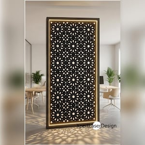 May include: A rectangular room divider featuring a black frame and a laser-cut panel with a repeating circular geometric pattern. The panel is backlit with warm white light, casting intricate shadows on the floor. The text XpertLaserDesign is visible.