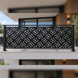 May include: A black metal balcony railing featuring a repeating laser-cut geometric pattern of small crosses and star-like shapes. The rectangular panel is framed by vertical posts and a horizontal top rail, creating a modern barrier design.