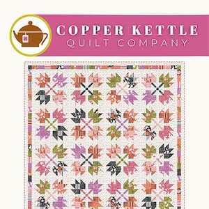 May include: A quilt pattern featuring a leaf pile design with a white background and colorful leaves in shades of pink, green, orange, and black. The pattern is called "Leaf Pile" and is for a runner or throw size. The pattern is from Copper Kettle Quilt Company and the pattern number is CKQ-2405.
