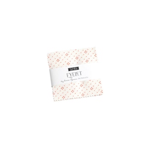 May include: A white fabric square with a red eyelet pattern. The fabric is labeled "Eyelet" by Moda Fabrics.