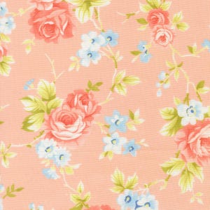 May include: A floral fabric featuring a repeating pattern of coral roses, light blue forget-me-nots, and green leaves on a peach background. The design has a vintage, romantic aesthetic, suitable for quilting or apparel.