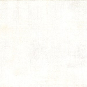 May include: Off-white fabric with a subtle, textured surface. The material has a slightly aged appearance, with faint variations in tone across the surface. The texture suggests a woven or possibly a linen-like material.