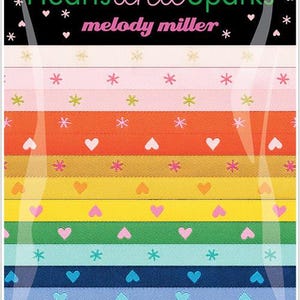 May include: Designer ribbon pack titled "Hearts and Sparks" by melody miller. The ribbons are in various colors, including pink, orange, yellow, green, blue, and black. Each ribbon features heart and star patterns. The website address www.renaissanceribbons.com is visible.