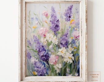 May include: A framed painting of a bouquet of purple, pink, and white flowers. The flowers are painted in a realistic style with visible brushstrokes. The frame is white with a distressed finish.