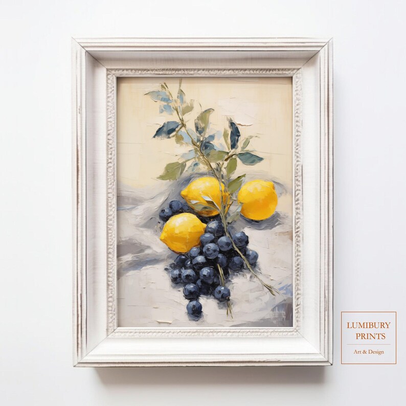 This still life painting features ripe yellow lemons and clusters of deep blue blueberries arranged on a soft neutral fabric. A leafy branch elegantly arches across the composition, adding balance and natural rhythm. The artwork’s rich textures and color contrasts create a refreshing atmosphere, ideal for rustic kitchen decor or modern farmhouse interiors.