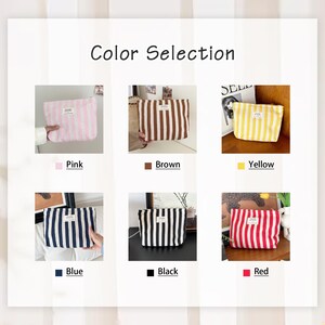 May include: A selection of striped cosmetic bags in various colors: pink, brown, yellow, blue, black, and red. Each bag has vertical stripes and a small rectangular label. The text "Color Selection" is at the top.
