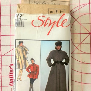 May include: A vintage sewing pattern packet with the word "Style" in red script. The packet features illustrations of women's coats and jackets. The size is RR (14-20). The background is a red and white grid.