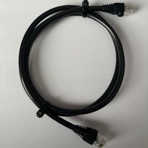 May include: Black ethernet cable with RJ-45 connectors on each end.