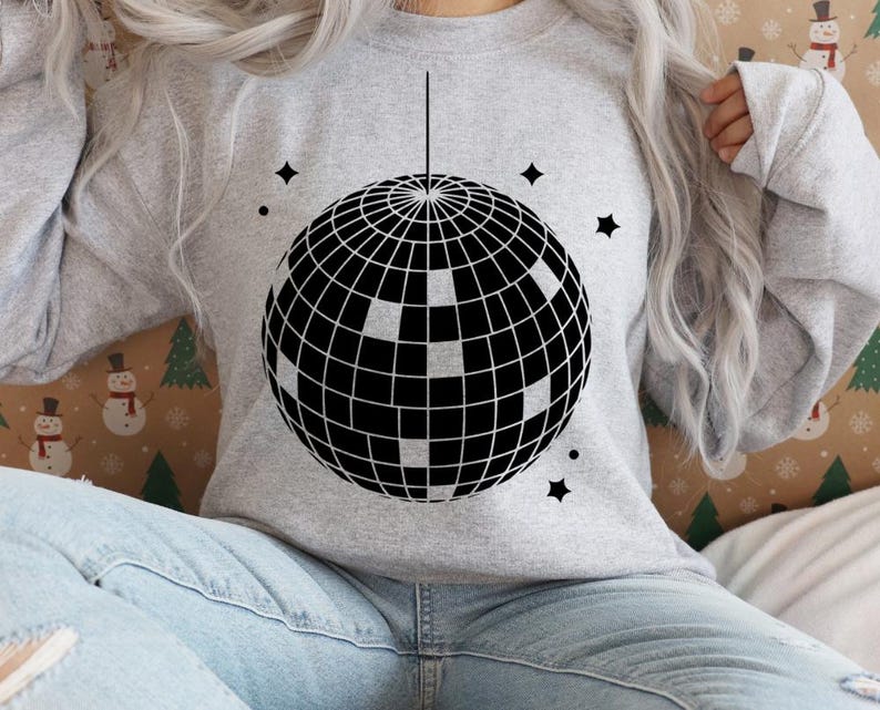 May include: A gray sweatshirt with a black and white disco ball graphic on the front.