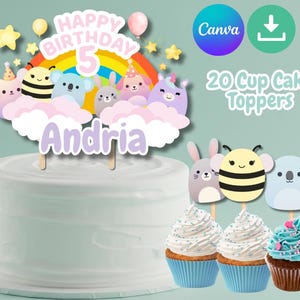 May include: A birthday cake with a topper that reads "Happy Birthday 5" above a rainbow and cartoon animals. The cake is white, and there are cupcakes with toppers that match the cake topper.