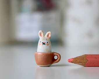 2cm miniature grumpy bunny in a teacup-  hand sculpted clay totem OOAK