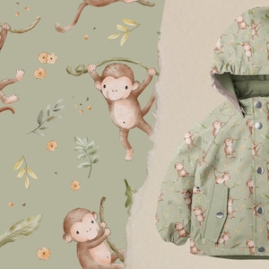 Könnte beinhalten: Eine grüne Kinderjacke mit Affen-Print. Die Jacke hat eine Kapuze und einen Reißverschluss.