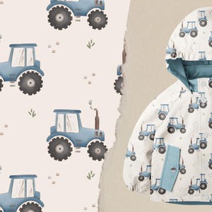 Könnte beinhalten: Eine weiße Kapuzenjacke mit blauem Futter und einem sich wiederholenden Muster aus blauen Traktoren auf weißem Hintergrund.