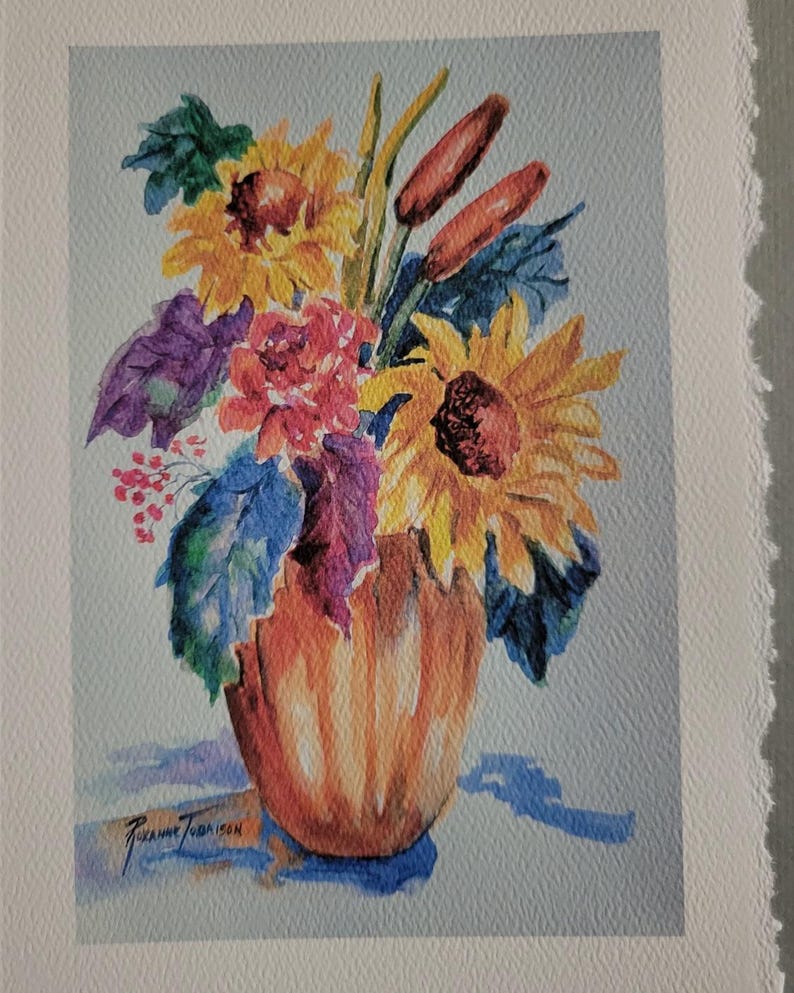 May include: A watercolor painting of a bouquet of sunflowers, red flowers, and green leaves in a brown vase. The painting is signed by the artist, Suzanne Townson.