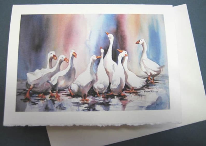 May include: A watercolor painting of a group of white geese standing in a shallow pool of water. The geese are facing different directions and some are looking up. The background is a watercolor wash of pink, purple, and blue. The artist's signature is in the bottom right corner of the painting.