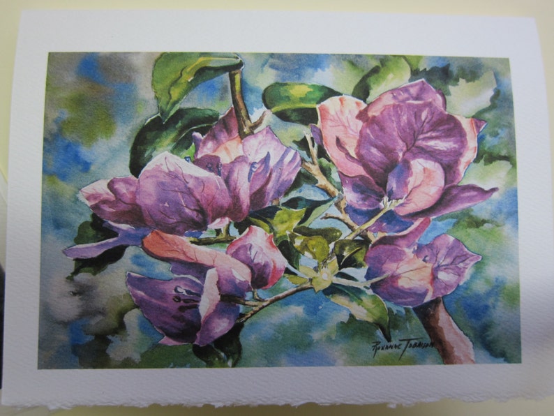 May include: Watercolor painting of pink bougainvillea flowers with green leaves. The flowers are in full bloom and have a delicate, feminine appearance. The painting is signed by the artist, "Susanne Traub"