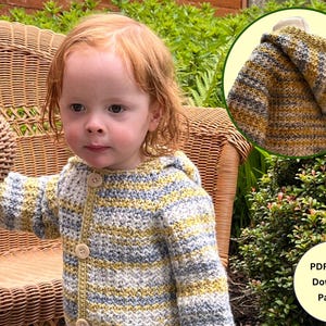 May include: A child wearing a striped crocheted hooded cardigan with buttons. The cardigan is in shades of yellow, blue, and white. The text "PDF Digital Download Pattern" is visible in the image.