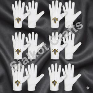 May include: Pairs of white gloves, each with a gold and blue emblem on the back. The emblem features a square and compass design. The gloves are displayed against a dark background.