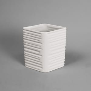 May include: A white, square ceramic vase with a textured, ribbed design on the exterior. The vase has a smooth, glossy finish and a simple, modern aesthetic. The interior is hollow and open at the top.