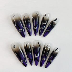 Void Bloom Press-On Nails – Purple and Black Ombre with Glossy Finish and Metallic Beads | Long Stiletto Gothic Nails