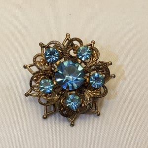 Vintage Mid-Century Brooch - Floral Starburst with Blue Rhinestones and Brass Toned Filigree, Unmarked