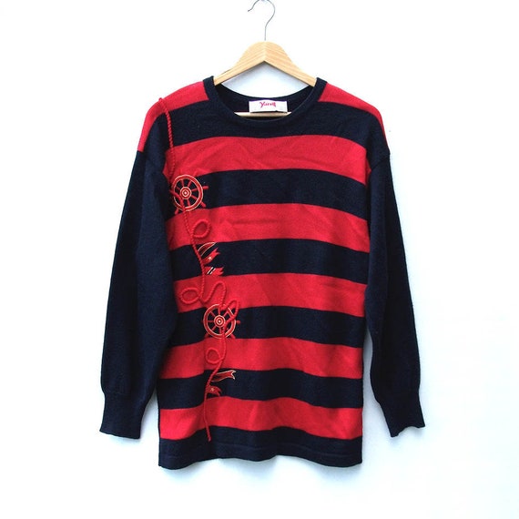 red and navy striped jumper