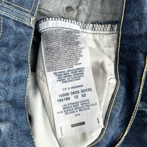 May include: A white Levi's clothing care label with black text. The label includes the Levi's logo, size information, and the text "Made in Morocco".