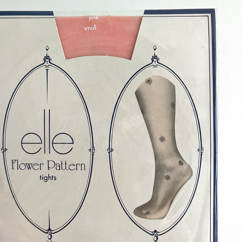 May include: A package for a pair of pink Elle tights with a floral pattern. The package has a small sample of the tights and the text "Elle Flower Pattern tights" on the front.