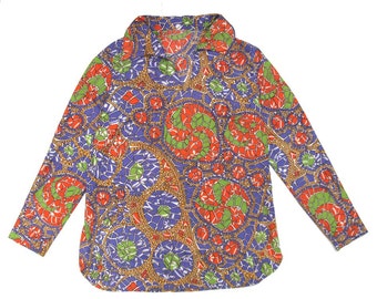 May include: A long-sleeved shirt with a colorful mosaic pattern in shades of red, green, blue, and gold. The shirt has a collared neckline and a button-up front.
