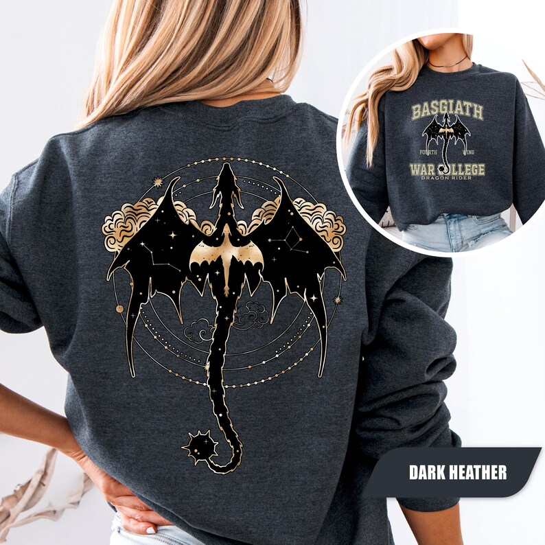 May include: Dark heather gray sweatshirt featuring a black and gold dragon design on the back. The dragon is set against a constellation background with gold accents. The front of the sweatshirt has the text "BASGIATH WAR COLLEGE DRAGON RIDERS".