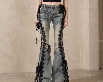 May include: Light blue denim flare jeans featuring a distressed wash, black lace trim running down the outer seams, and black ribbon lace-up details at the hips and along the legs. The jeans have a classic button and zipper fly closure.