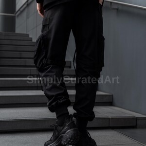 May include: Black cargo pants with multiple pockets and a drawstring detail. The pants are worn with black sneakers. The image is taken in front of a gray staircase.