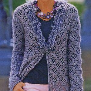 May include: A lavender open-front cardigan with a diamond-patterned knit design. The cardigan features a fringed collar and a decorative clasp. The model is wearing a dark blue top, pink pants, and a beaded necklace. The image also contains text in the upper right corner.