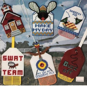 May include: A vintage craft pattern for plastic canvas fly swatter covers. The designs include a schoolhouse, a fly with "Make My Day", a pie, "Swat Team", a target, and "Buzz Off". The pattern is from the American School of Needlework.