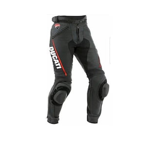 May include: Black and gray motorcycle pants with knee protection pads. The pants feature the white "Ducati" logo with a red stripe on the left leg. The pants have a zipper closure and a belt.