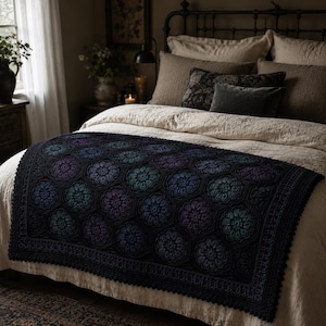 May include: A rectangular crochet blanket featuring a repeating hexagonal floral motif in shades of deep purple, teal, and black. The blanket has a solid black border with a scalloped edge, showcasing intricate yarn work and a textured surface.