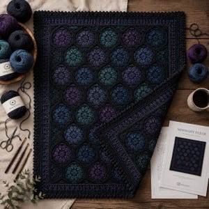 May include: A rectangular crochet blanket featuring a repeating pattern of dark floral motifs in shades of purple, teal, and blue, bordered by a black scalloped edge. The blanket is displayed alongside yarn balls, crochet hooks, and a pattern sheet.