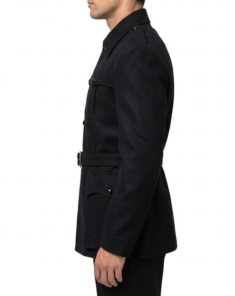 May include: A black wool coat with a belted waist and multiple pockets. The coat has a classic military-inspired design with a button-up front and a notched collar. The sleeves have buttoned cuffs. The coat is a solid black color.