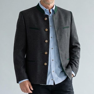 May include: A charcoal gray jacket with a mandarin collar and gold buttons. The jacket has dark green trim on the collar and pockets. A light blue and white checkered shirt is visible underneath the jacket.