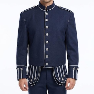 May include: Navy blue jacket with a mandarin collar, silver buttons, and white piping. The jacket features decorative silver accents on the shoulders and cuffs. The design includes a unique, curved hemline with vertical silver stripes.